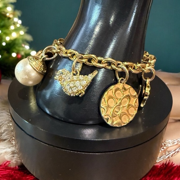 Coach Gold Tone Multi Charm Bracelet. Includes locket Heart, Bird, Star and more - Picture 6 of 17